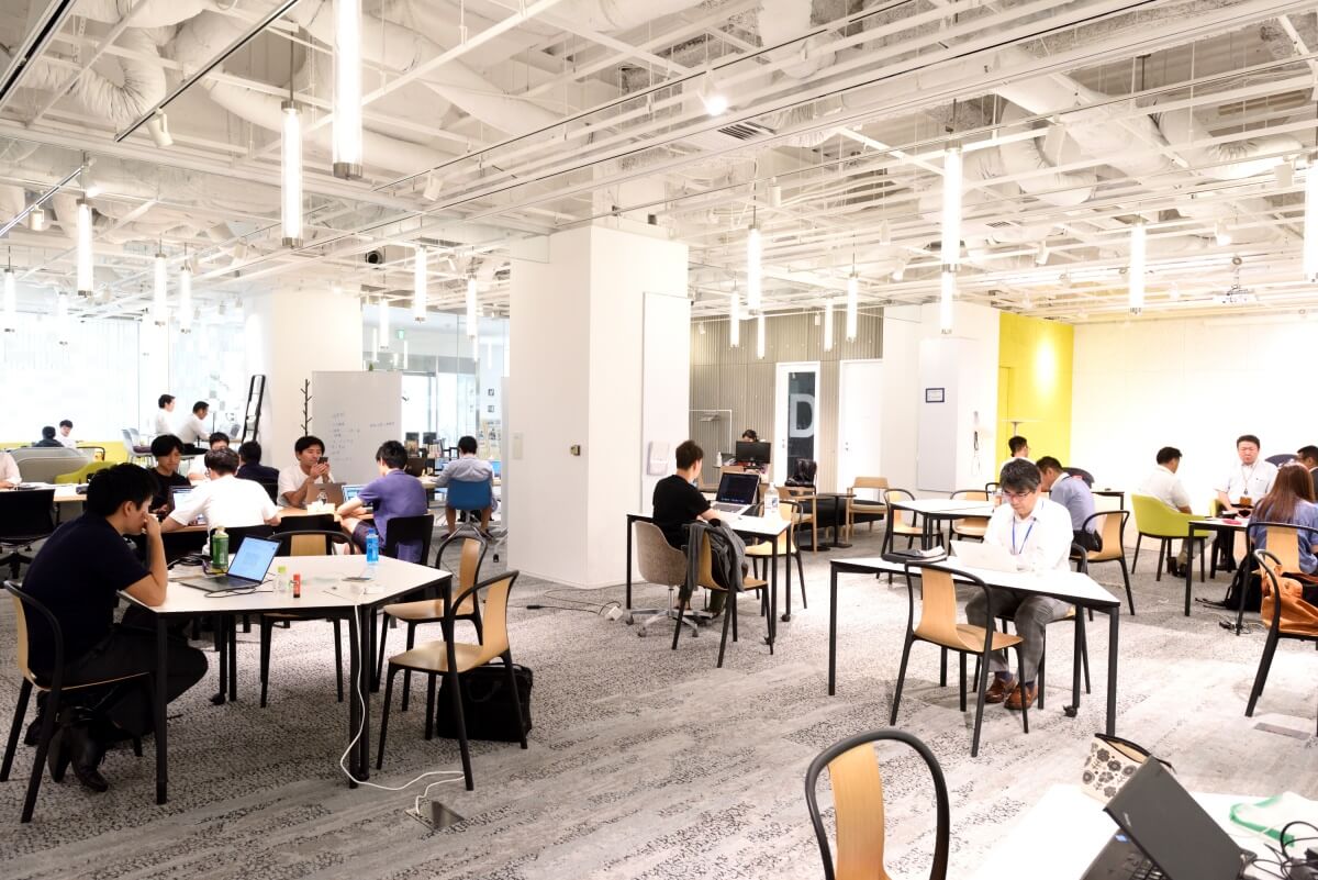 Plug and Play's open office space with people working