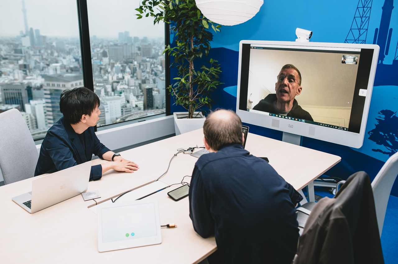 Yoshihisa Aono and his interpreter in a video conference with General McChrystal