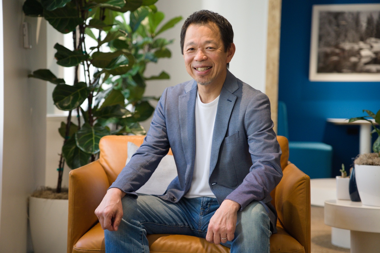 Osamu Yamada, sitting and smiling