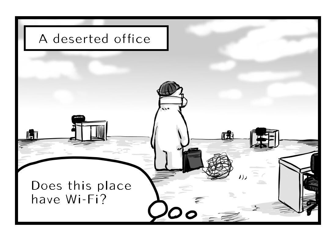 A deserted office with desks scattered around far away from each other