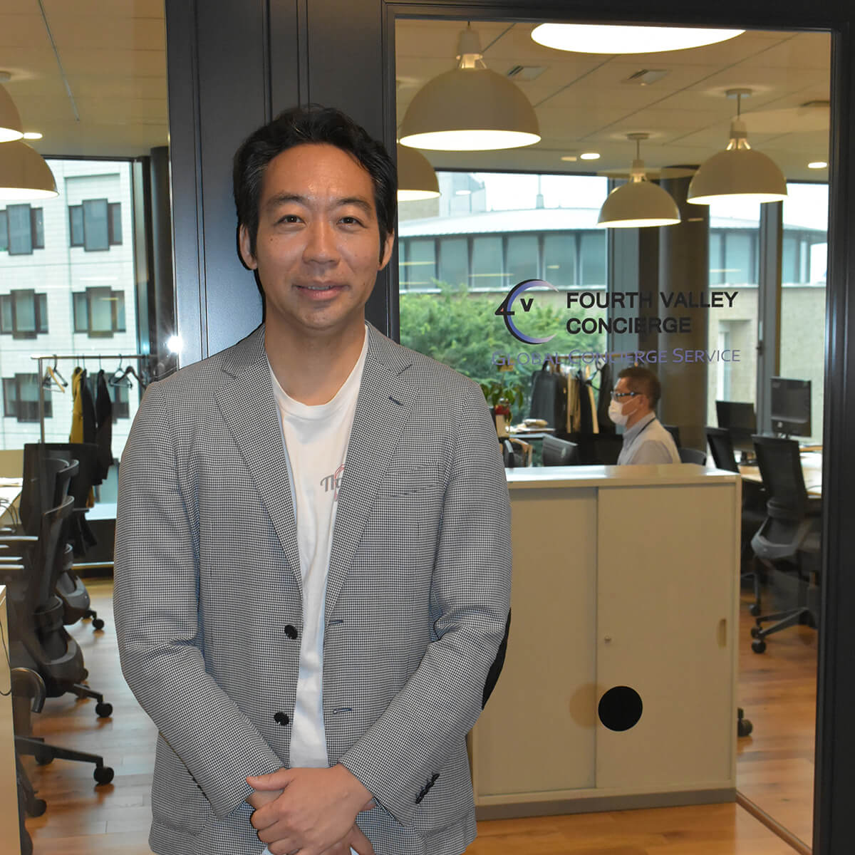 Fourth Valley CEO Yohei Shibasaki poses in front of his company's office